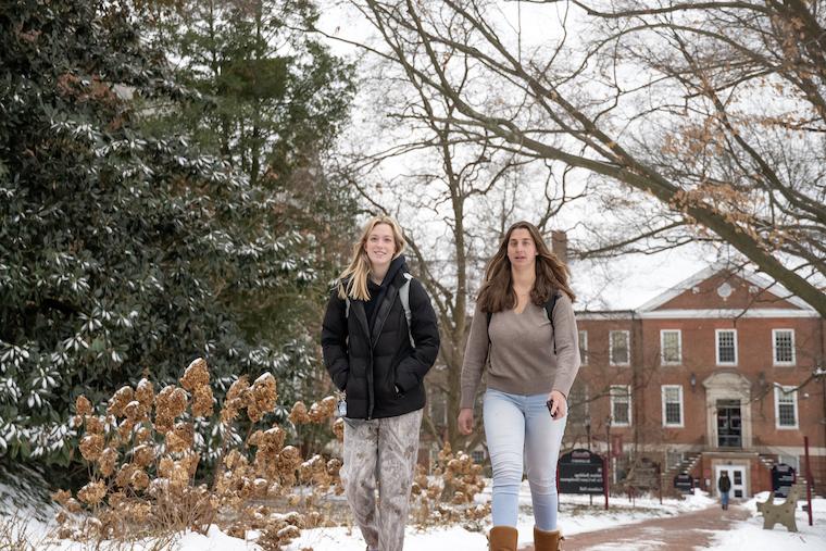 Students on Washington College's campus in winter. 